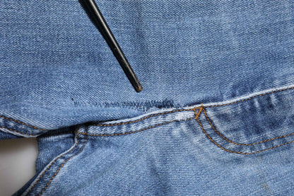 Blue Washed Tattered Logo Plaque Denim Jeans