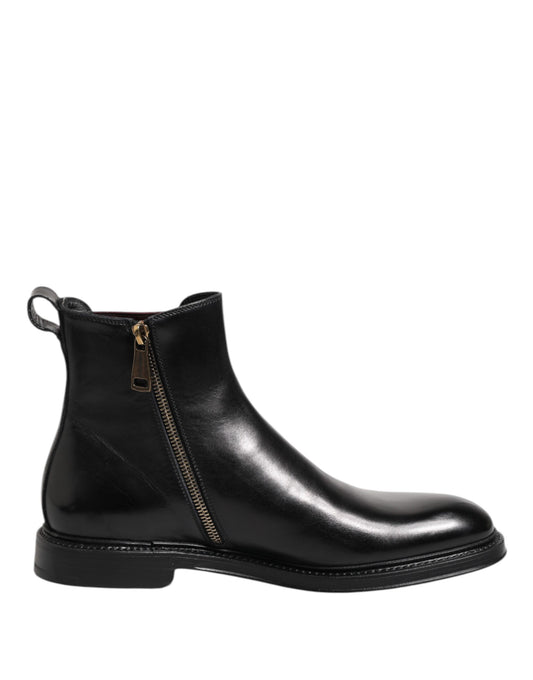 Black leather Chelsea boot with a zipper on a white background